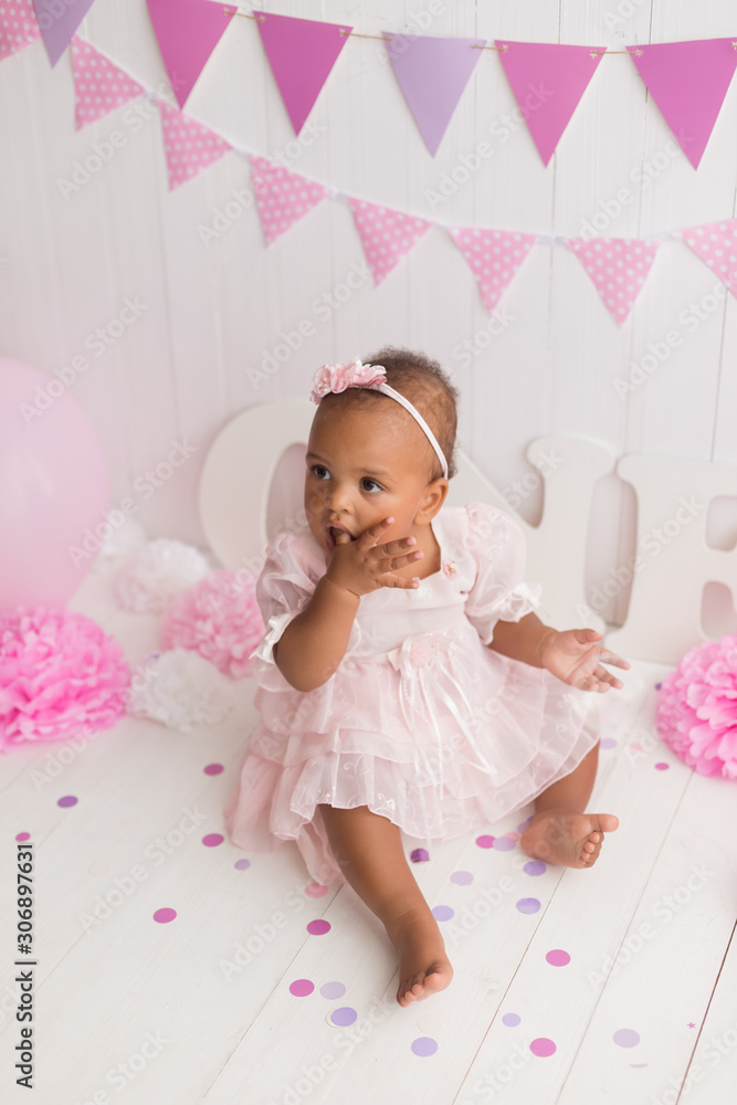 little girl black on white background. baby's first birthday little girl black on white background. baby's first birthday