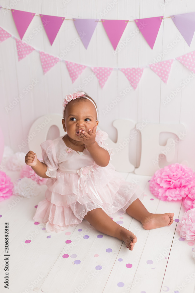little girl black on white background. baby's first birthday little girl black on white background. baby's first birthday