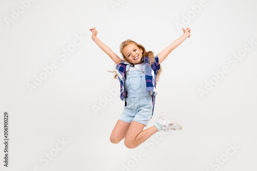 pretty european girl jumping on a white background