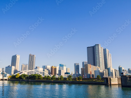 Scenic view of the tall buildings by river in the center of the big city on modern building background. © Look Aod 27