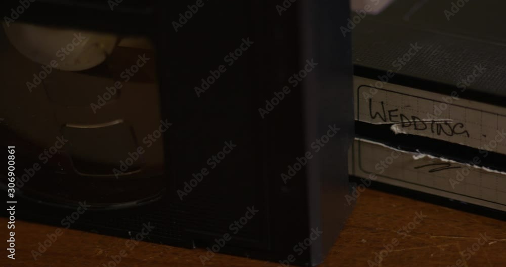 Close up panning shot of old broken wedding VHS tape Close up panning shot of old broken wedding VHS tape