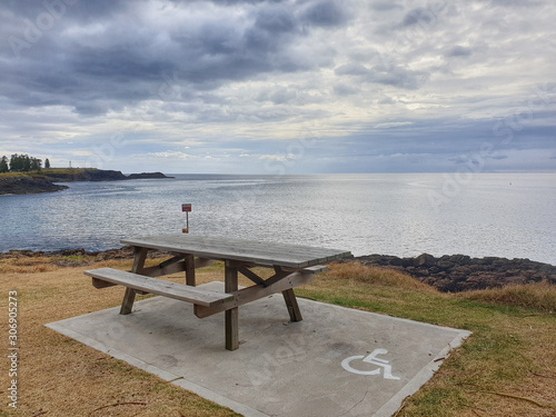wooden bench on the beach with disable area © Martha