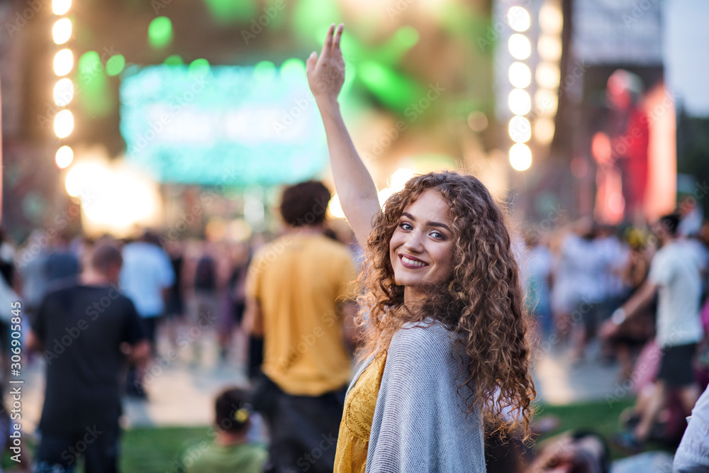 Beautiful young woman dancing at summer festival. Beautiful young woman dancing at summer festival.