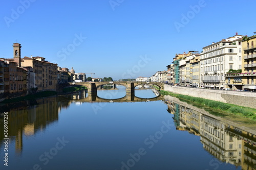 View of Arno river with Ponte Santa Trinita from Ponte Vecchio. Florence  Italy. The oldest elliptic arch bridge in the world.