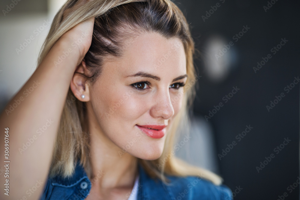 Close-up portrait of happy young woman indoors at home. Close-up portrait of happy young woman indoors at home.