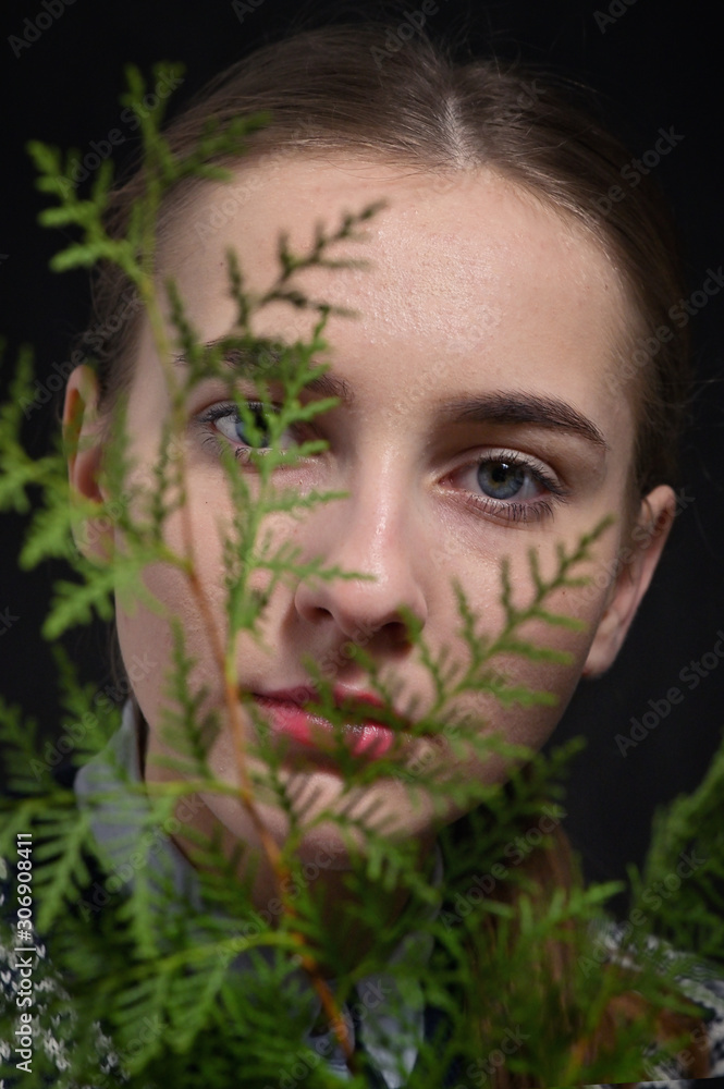 Young woman among the leaves