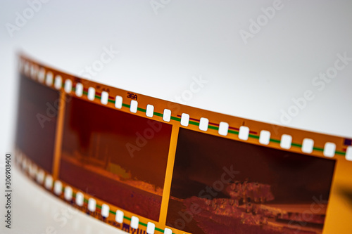 developed color 35 mm negative lies on a light background.