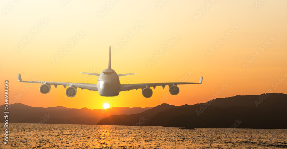Airplane flying above clouds during sunset Airplane flying above clouds during sunset