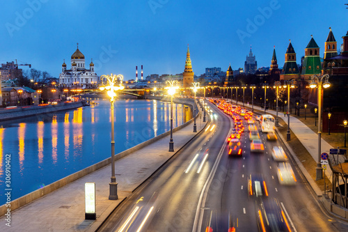 view of the Kremlin embankment from Moskvoretsky bridge to the Cathedral of Christ the Saviour and the water tower in the evening