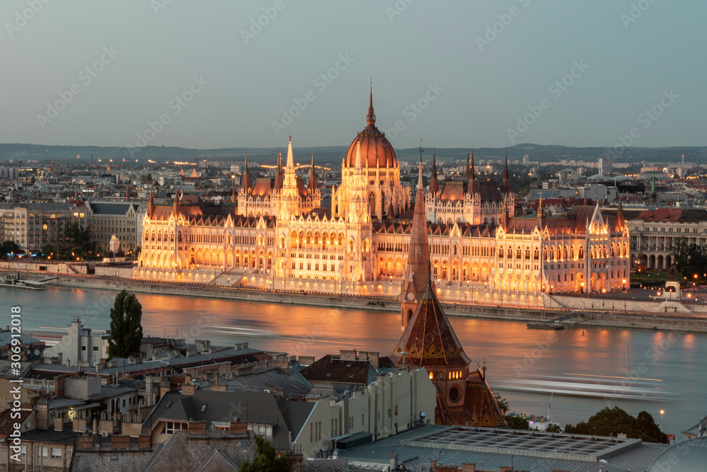Fototapeta premium Awesome view of Budapest Parliament illuminated at sunset