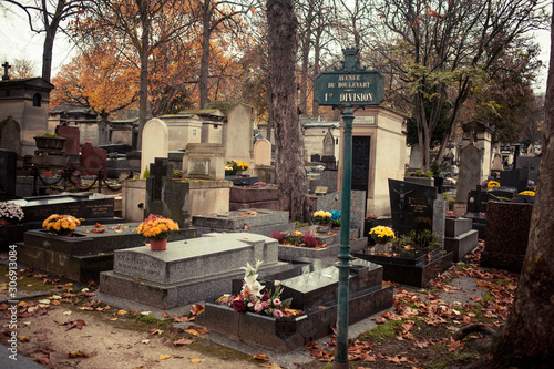 Paris, France - November 18, 2019: Graves and crypts in Pere Lachaise Cemetery, This cemetery is the final resting place for many famous people