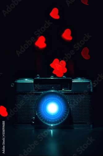 camera with light in lens and boketh behind photo