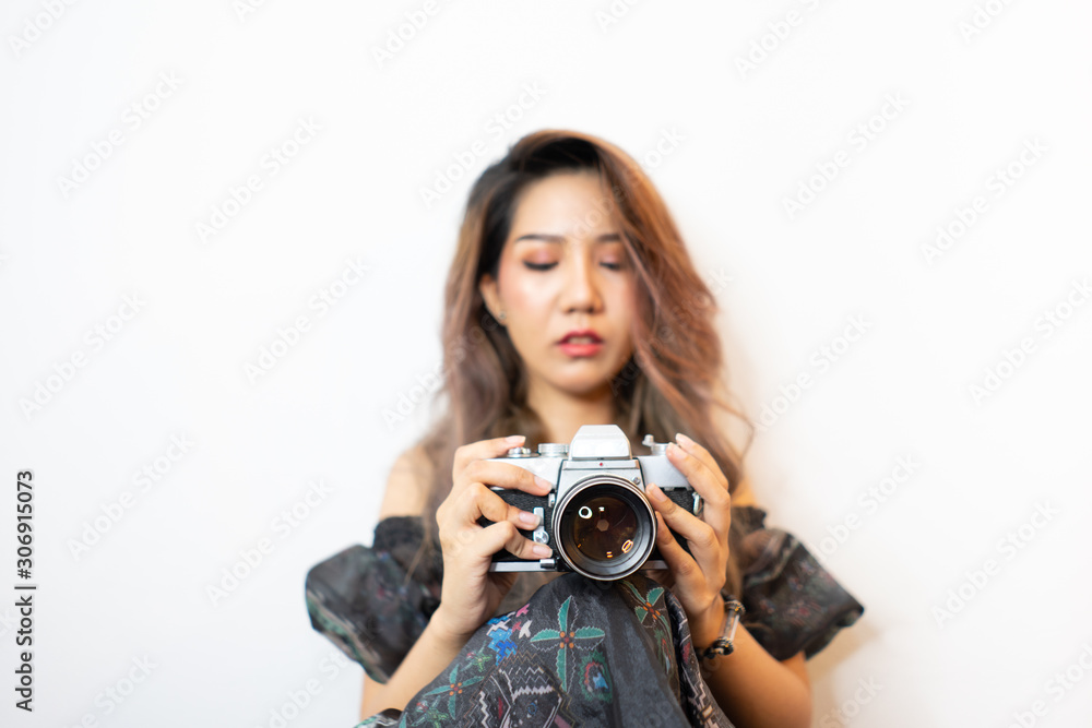 Young asian women photographer with camera on isolated background