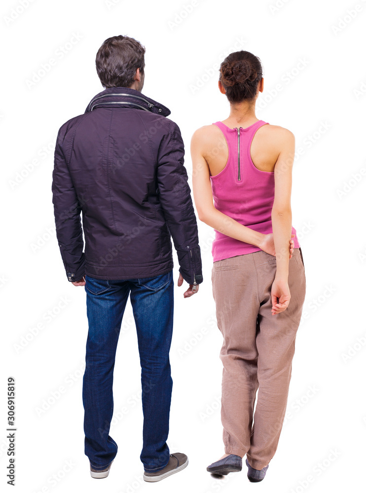 Back view of couple. beautiful friendly girl and guy together.