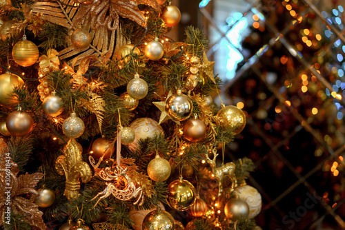 Golden balls on the Christmas tree closeup