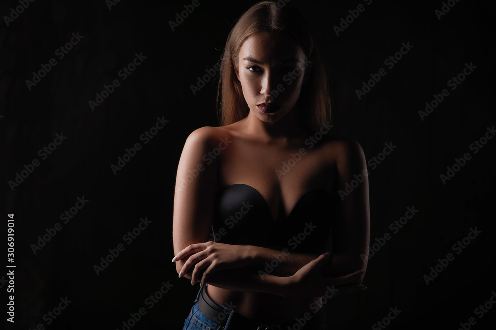 portrait of a beautiful girl on a dark background portrait of a beautiful girl on a dark background