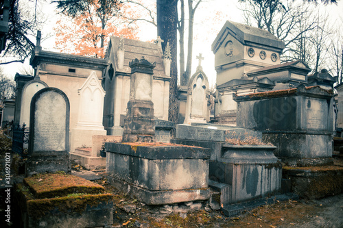 Paris, France - November 18, 2019: Graves and crypts in Pere Lachaise Cemetery, This cemetery is the final resting place for many famous people