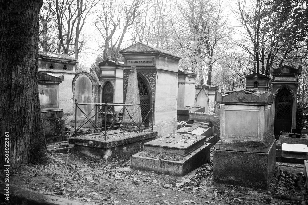 Paris, France - November 18, 2019: Graves and crypts in Pere Lachaise Cemetery, This cemetery is the final resting place for many famous people Paris, France - November 18, 2019: Graves and crypts in Pere Lachaise Cemetery, This cemetery is the final resting place for many famous people