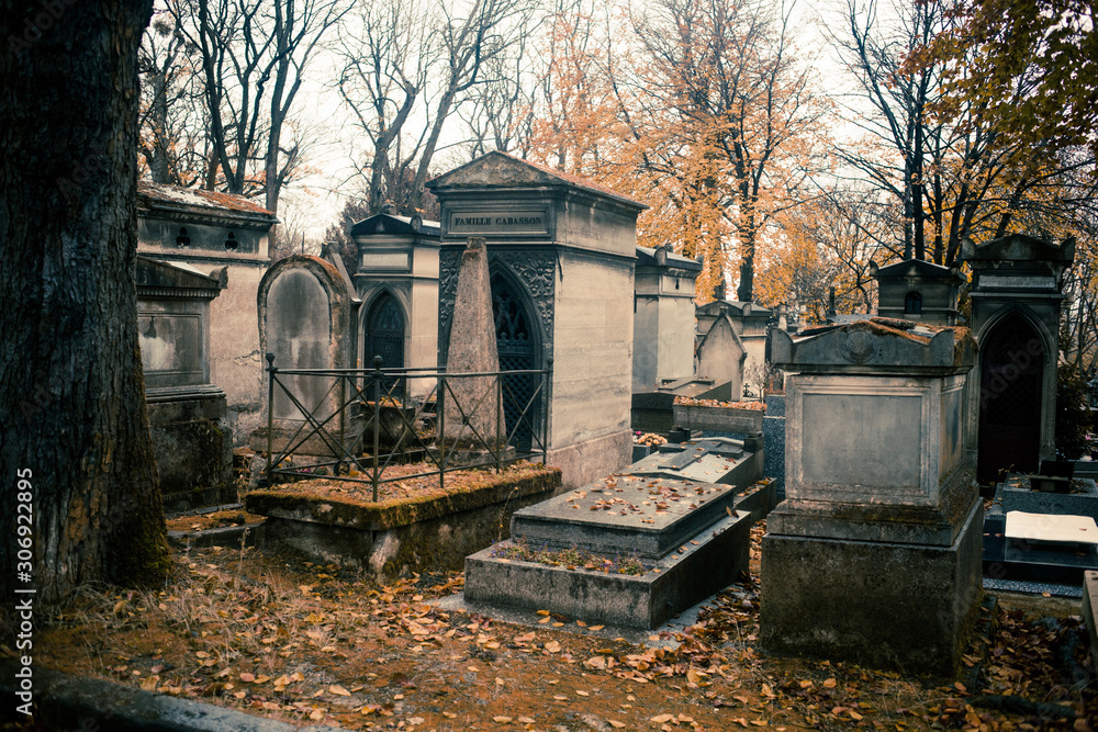 Paris, France - November 18, 2019: Graves and crypts in Pere Lachaise Cemetery, This cemetery is the final resting place for many famous people Paris, France - November 18, 2019: Graves and crypts in Pere Lachaise Cemetery, This cemetery is the final resting place for many famous people