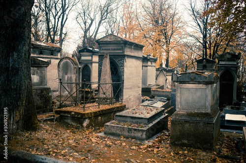 Paris, France - November 18, 2019: Graves and crypts in Pere Lachaise Cemetery, This cemetery is the final resting place for many famous people