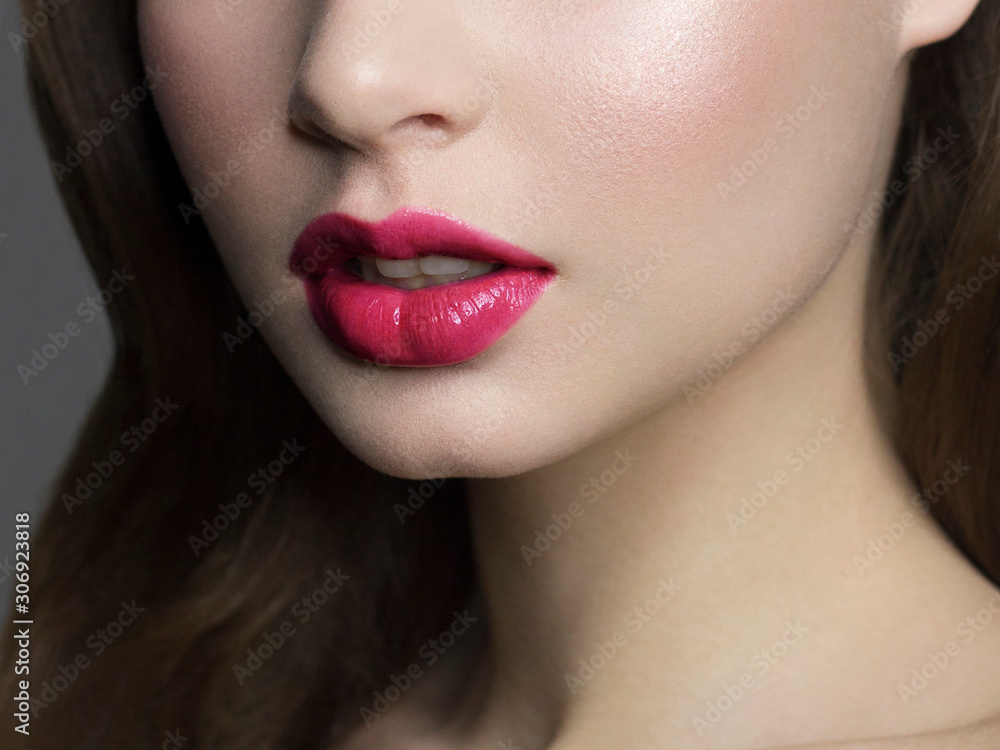 Sexual full lips. Natural gloss of lips and woman's skin. The mouth is closed. Increase in lips, cosmetology. pink lipstick. Open mouth and with teeth. brunet hair. pink lip gloss Sexual full lips. Natural gloss of lips and woman's skin. The mouth is closed. Increase in lips, cosmetology. pink lipstick. Open mouth and with teeth. brunet hair. pink lip gloss
