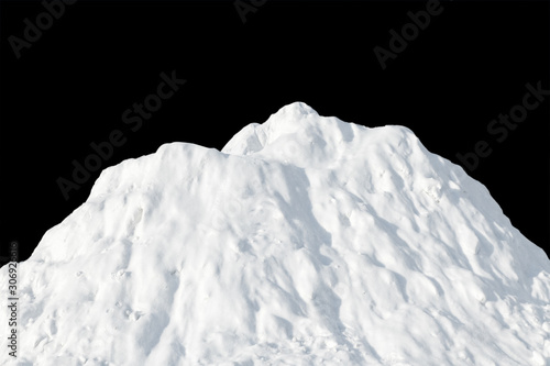 White snow heaped in a pile on a black background