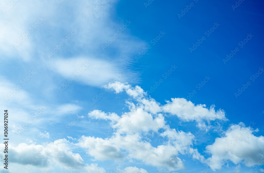 Beautiful blue sky and white cumulus clouds abstract background. Cloudscape background. Blue sky and fluffy white clouds on sunny day. Nature weather. Bright day sky for happy day background.