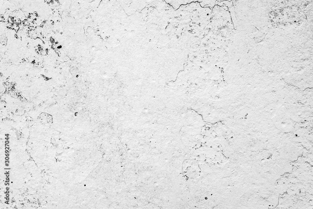 Texture of a concrete wall with cracks and scratches which can be used as a background Texture of a concrete wall with cracks and scratches which can be used as a background