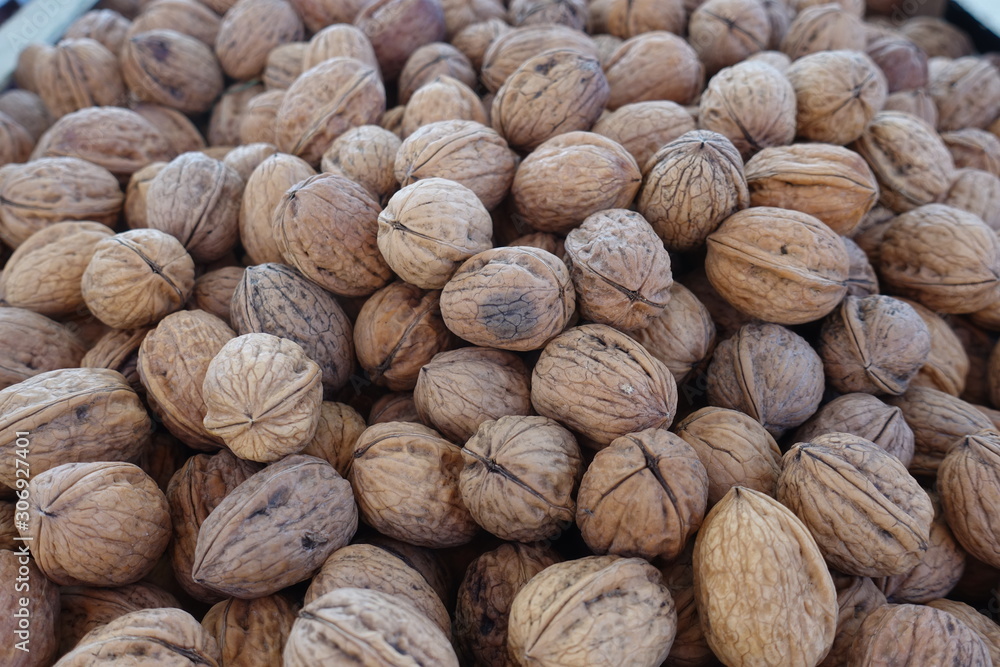 closeup of walnuts on display at the market closeup of walnuts on display at the market