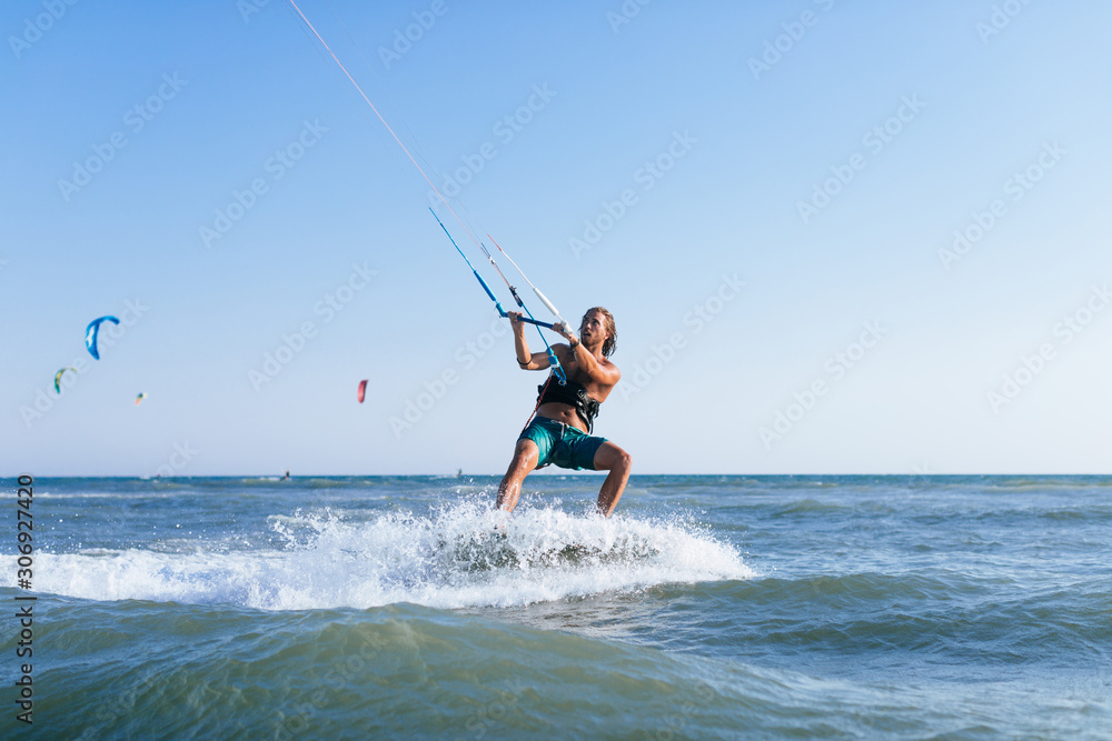 Man Kitesurfing on the Sea