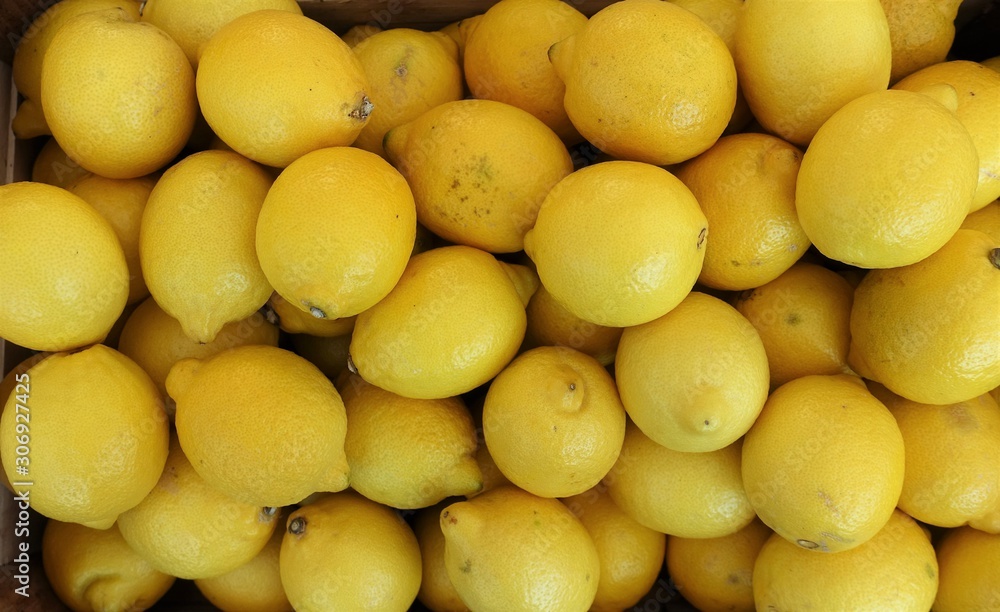 closeup of lemons on display at the market