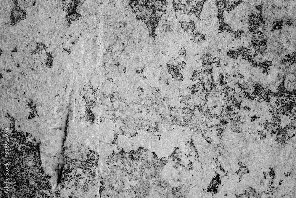 Texture of a concrete wall with cracks and scratches which can be used as a background