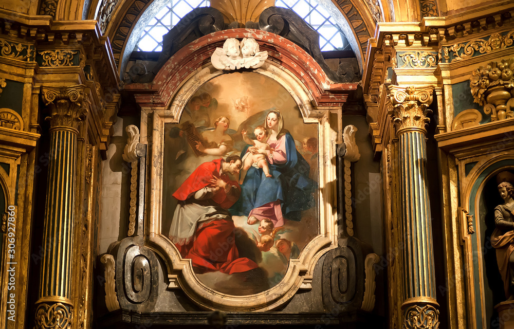 Great paintings with Mother of God inside golden interiors of 16th century St John's Cathedral, Roman Catholic church. Valletta, Malta.