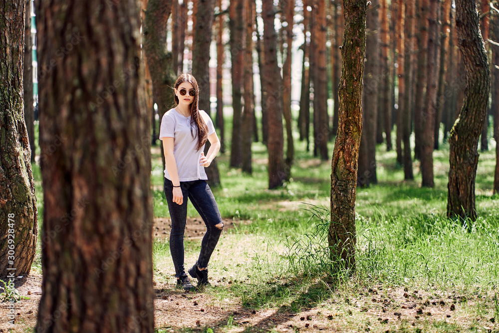 portrait of young teen girl in sunglasses on nature