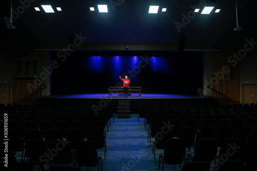 Teenagers rehearsing in a theatre photo