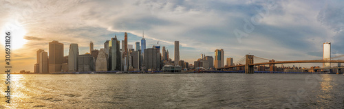 Banner and Panorama of New york Cityscape with Brooklyn Bridge over the east river at the evening time  USA downtown skyline  United states of America  Architecture and building with tourist concept