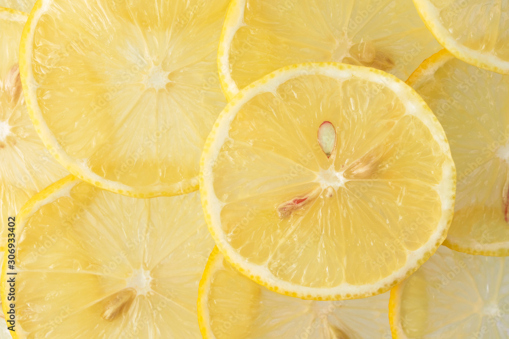 Close-up yellow lemon cross section slices pattern, top view. Fresh juicy food concept Close-up yellow lemon cross section slices pattern, top view. Fresh juicy food concept