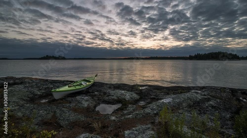 4K time lapse of a sunset and a kayak next to a lake in Northwest Ontario, Canada.