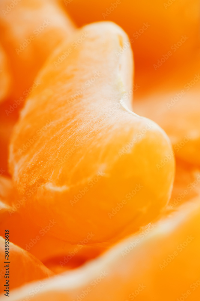 Slices of juicy tangerines close up as background texture. Slices of juicy tangerines close up as background texture.