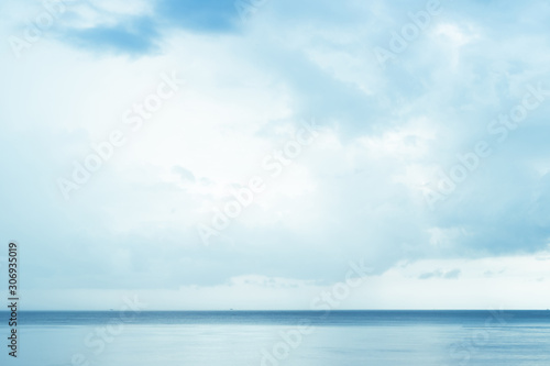 Hard light blue abstract sky over the beach, some cloud flowing, color gradient in layer © TeeRaiden