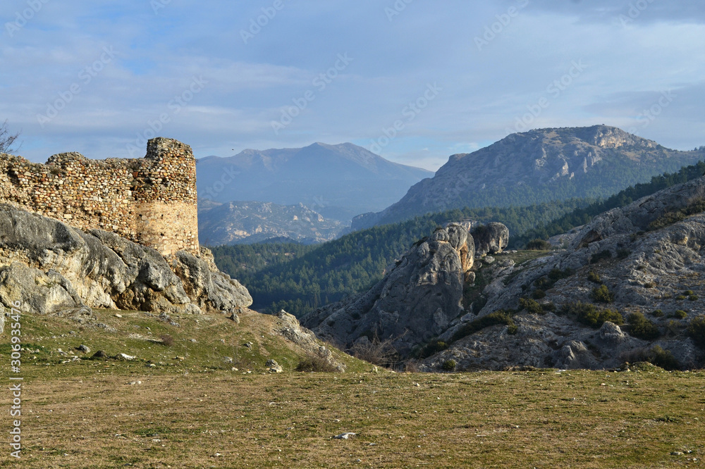 Fototapeta premium Byzantine castle ruin of Sidirokastro in the Northern Greece is also a great vantage point that looks to all directions. Limestone mountains of Angistro are the backdrop.