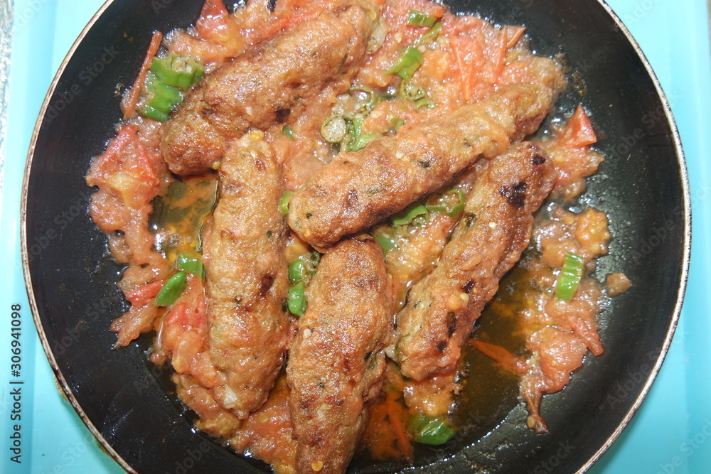 Fototapeta premium Delicious spicy home made fried kebab with green pepper