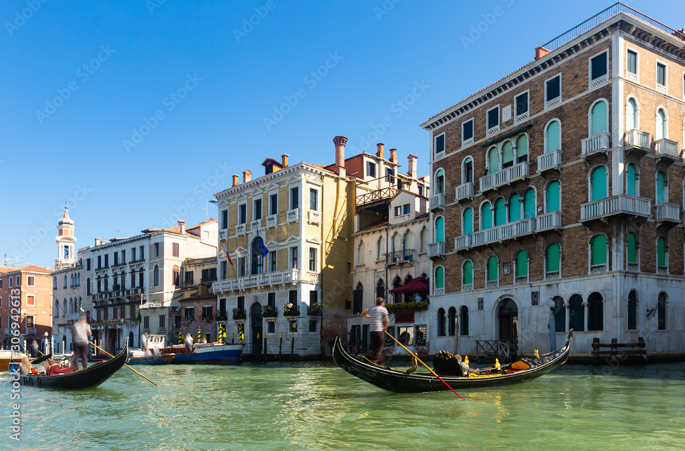 Ancient buildings and boats in the Grand canal in Venice. Italy