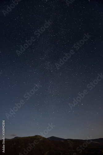 Starry night sky with silhouette foreground