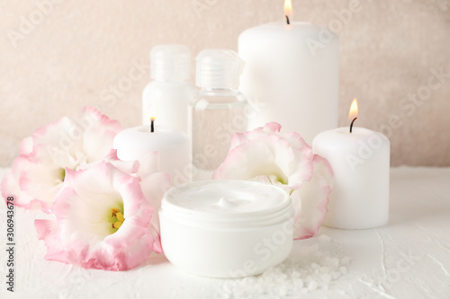 Spa accessories and beautiful flowers on white background  close up