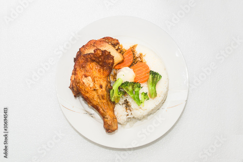 A hong kong-style Fried chicken rice on a white background