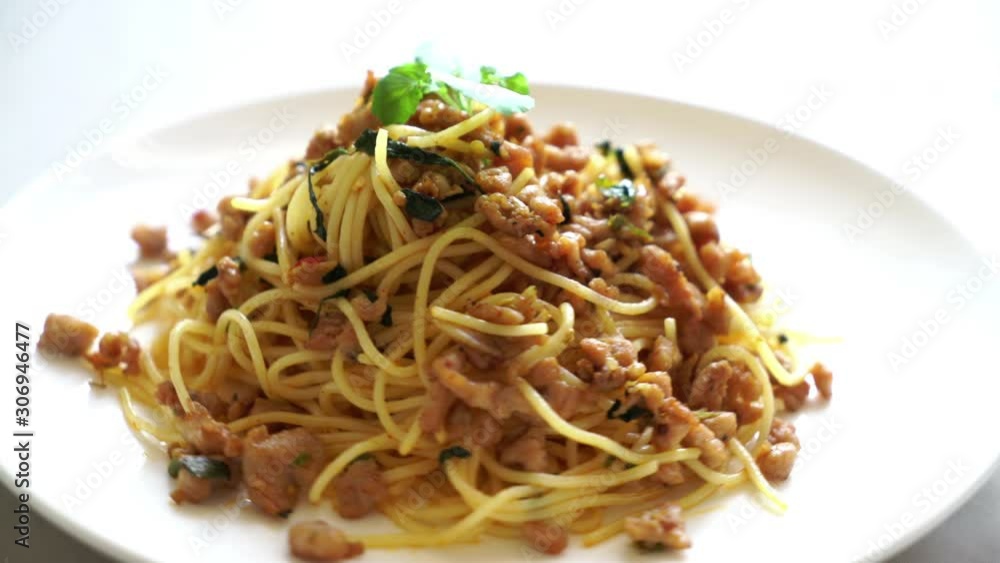 stir-fried spicy spaghetti with minced pork and basil stir-fried spicy spaghetti with minced pork and basil
