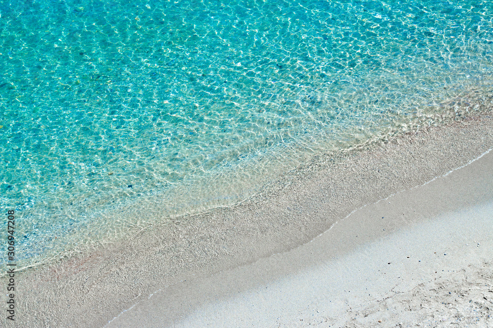 Turquoise sea waves and white sand, Mediterranean sea. Aerial view.