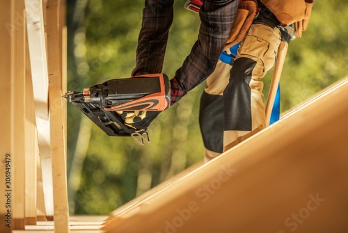 Tableau sur toile Worker with Nail Gun