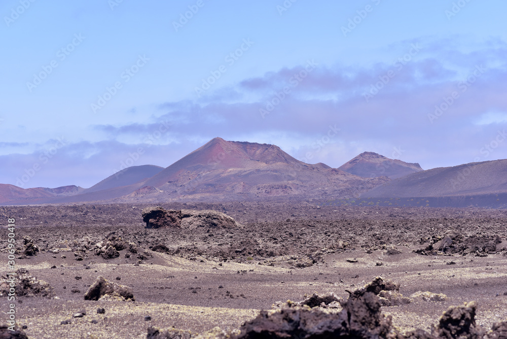 Fire Mountains and volcanic lava stone in Timanfaya National Park, Lanzarote, Canary Islands, Spain